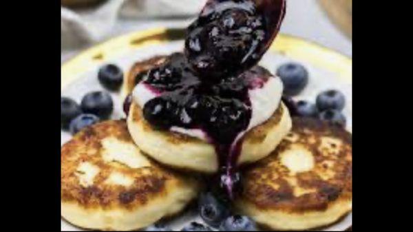 Syrniki - tvorog pancakes 
Enjoy with blueberry jam, honey 
Made fresh everyday