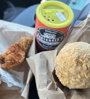 Crawfish boudin ball, chicken cracklin and Kartchner's seasoning