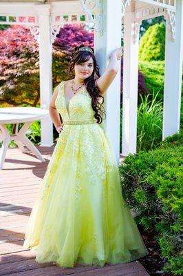 Quinceañera Photoshoot.  Birthday girl wearing a yellow dress.