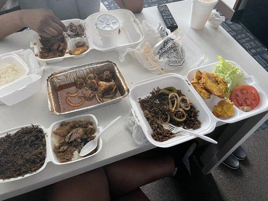 Black rice with oxtail, banan peze, white rice with legume and black beans. Got passion fruit juice and lemonade