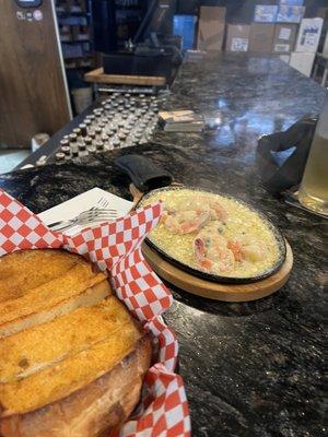 Sizzling shrimp and garlic bread. Unique and delicious!