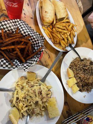 Cajun chicken Alfredo, sweet potato fries, gator po boy, jambalaya.