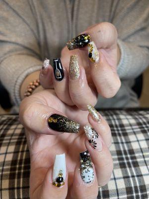 New Years Eve Nails by Holly & Mary! Don't forget to ask for gel X-design and why not get a shoulder massage while you get your nails done.