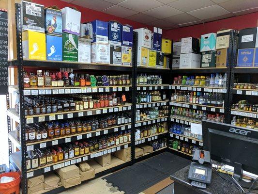 Small bottles of liquors behind the counter.