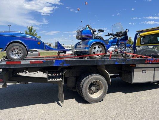 trike with trailer attached towed as one unit.