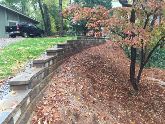 Retaining wall and fescue lawn installation.