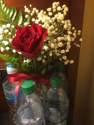 Flowers by Lucas did the rose, greens, and baby's breath.  I did the water bottles.