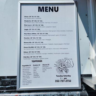 The menu on the outside of the food truck.