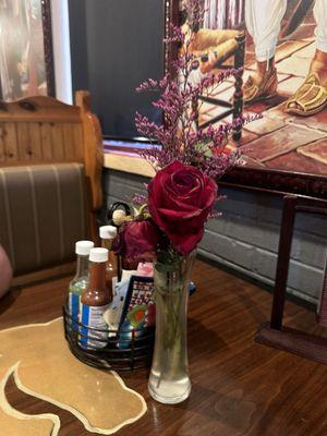 The cute little flower they have on each table.