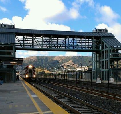 Northbound train coming to a stop at the platform.