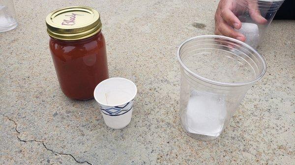 Bloody Mary. Ice cube and cups provided.