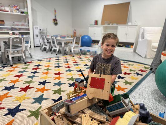 Great playroom /class room environment in a home. My son loves playing with the train sets