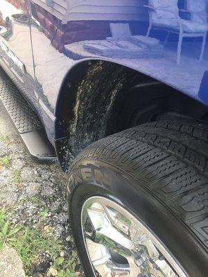 The front passenger side wheel well. The tire and wheel look sharp! The dirt, not so much.