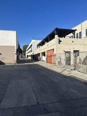 Alley way entrance next to the parking structure