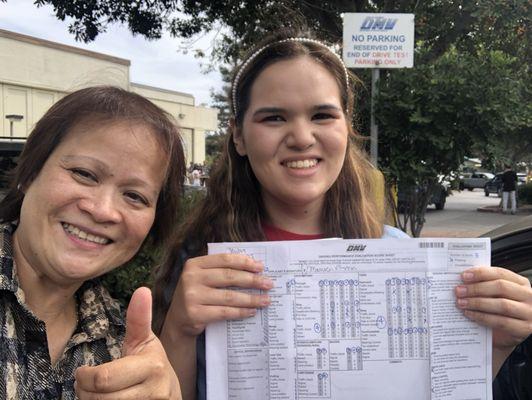 Instructor Tess (on the left), Newly licensed driver! (on the right). Location: Santa Clara DMV.