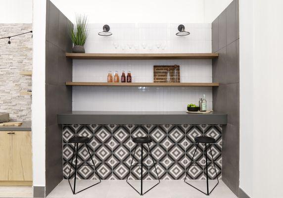 Bar: Chateau 12" x 12" Decorative Tile in Canvas, Smoke and Midnight.
 Wall: Provincetown 2.5" x 9" Floor & Wall Tile in Porch White