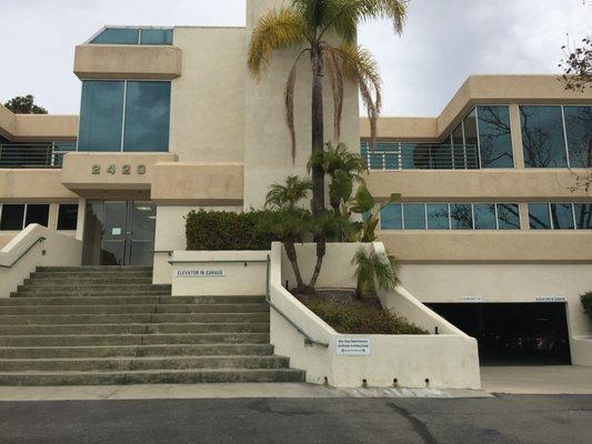 Building entrance.  You can enter the parking garage to the right and take the elevator.