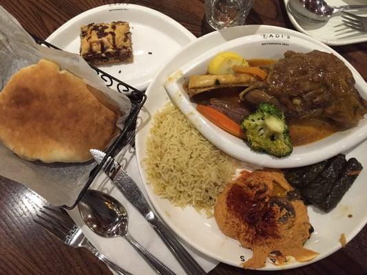 Pita bread, spicy hummus, grape leaves, rice, and Lamb Shank for dinner; Baklava for dessert.