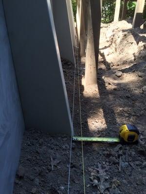 The supports should have been set to the yellow string. Over a 12 foot run, it's off by 2 inches!