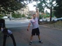 Michael performing a kettlebell snatch in Central Park