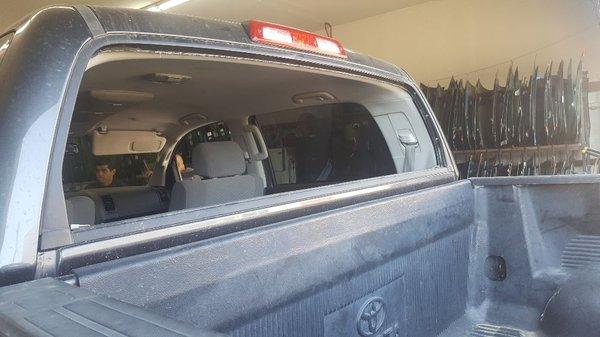 Before picture of a Toyota Tundra back glass power slider.