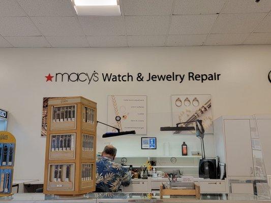 Watch repair guy at work.