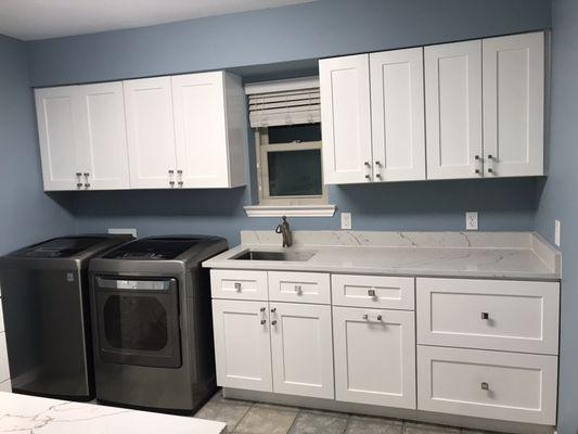 White shaker cabinets with quartz countertops