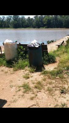 Overflowing trash at the boat landing and dock.