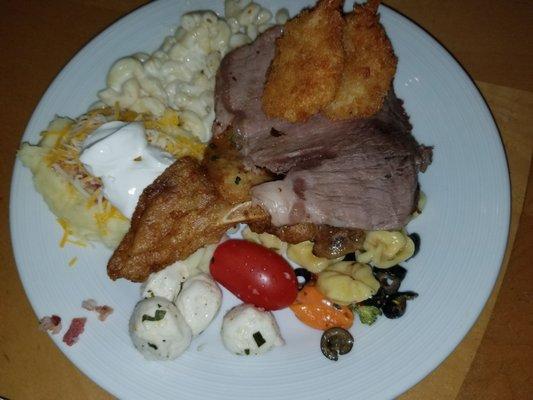 Load mashed potatoes, tortellini salad, fresh moz and tomato salad, prime rib, pork chop, butterfly shrimp, mac and cheese