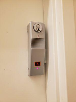 Door emergency exit device alarm service