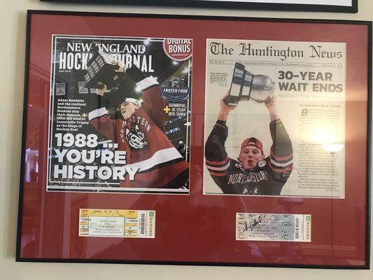 Newspaper & magazine covers + signed tickets preserved under UV glass.