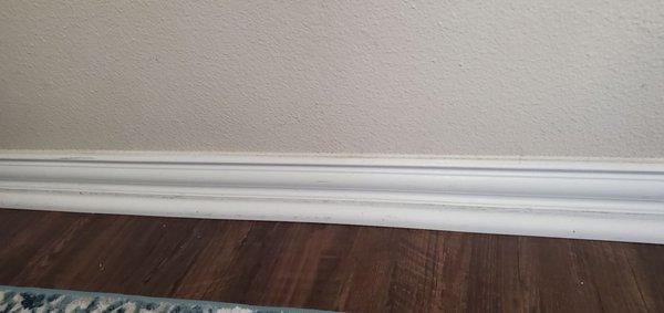 Scratched up primer baseboard