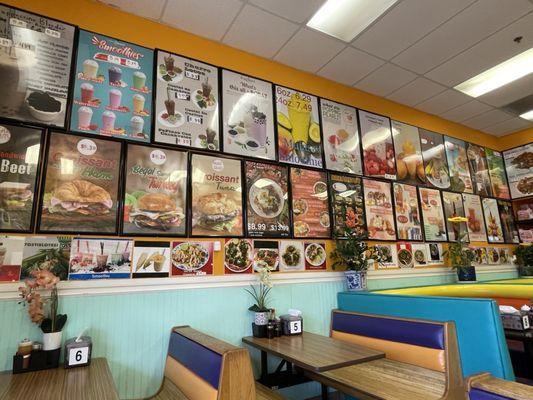 Restaurant seating, menu covers all the walls.