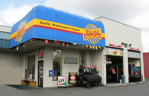 Village Auto Care & Tires main shop enterance. Car repair bays and tires displays.