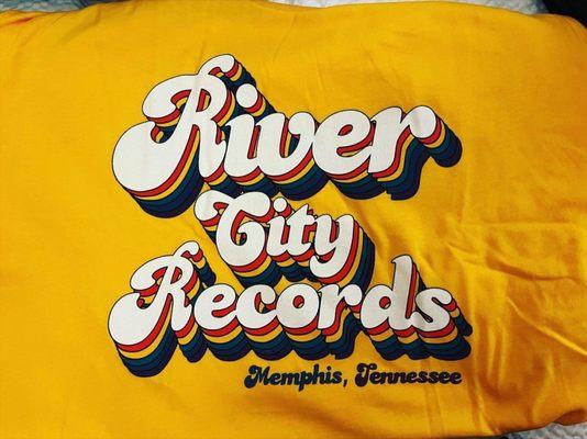 RCR logo on Yellow T-Shirt in 70s font