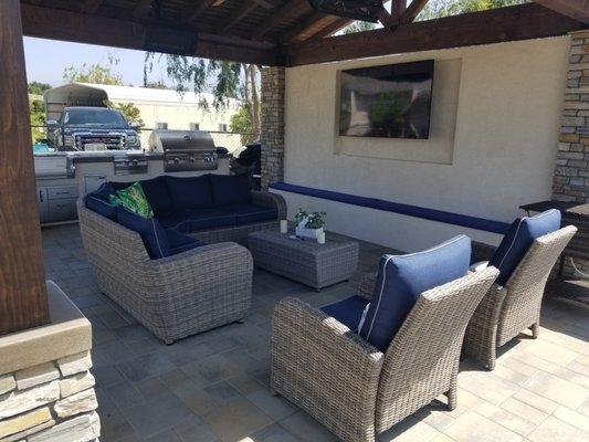 Outdoor Living Area with Privacy TV wall, Outdoor kitchen with tri-tap kegerator, Fire Magic BBQ components