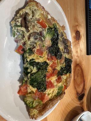 Veggie omelet with bacon. It was crispy, i think cooked in lots of oil or butter. But yummy, lots of veggies.