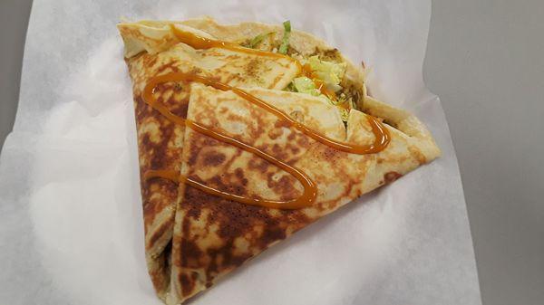 Pesto Pete Crêpe: Chicken, sautéed onion, pesto sauce, mozzarella, white cheddar, lettuce, tomato, carolina BBQ sauce drizzle