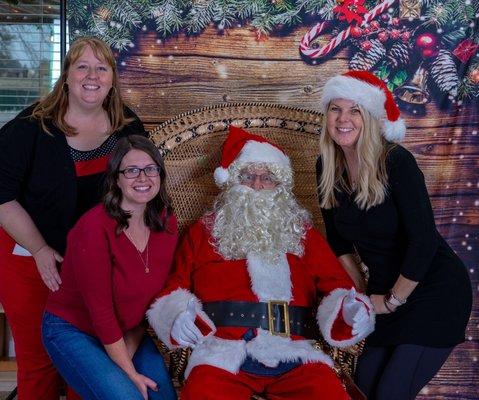 Miss Jacki, Miss Jenny and Miss Julie with Santa at the Annual Holiday Tea.