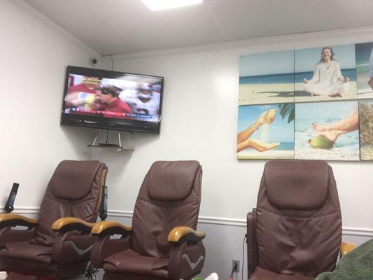 Pedicure chairs and TV