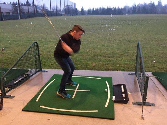 Nice driving range.  Half covered/Half uncovered.  Faces west - but not a problem until the sun is setting in Summer.