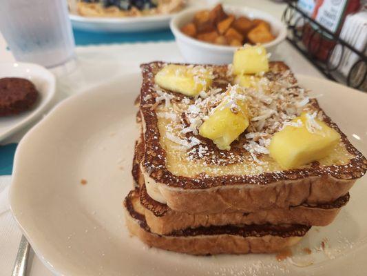 Pina colada Fresh Toast. Cheese cake is in between the layers!