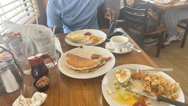 Eggs, pancakes, grits, hasbrowns, chicken sausage