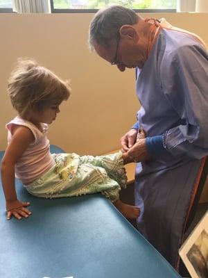 The great Dr. Pike putting my kiddos shoes on after her appt. So helpful, knowledgable and sweet!