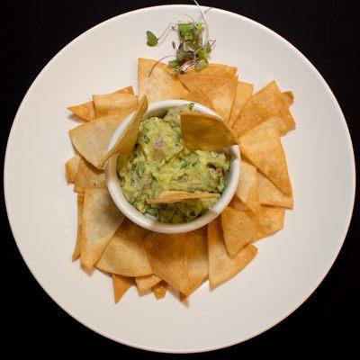 GUACAMOLE - Onions, tomatoes, cilantro, lime juice served with tortilla chips.