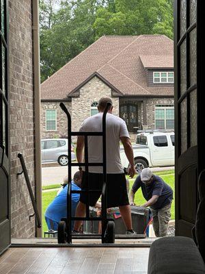 Movers hired from Craigslist attempting to move a safe they were hired to move, but lacked proper skills and equipment to move it.