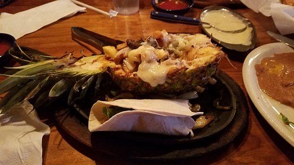 Fajita Pineapple, with shrimp, and chicken fahita mix served in the pineapple half.  It is fantastic.