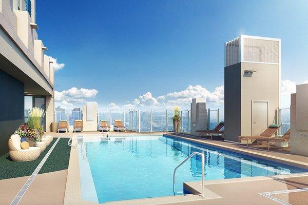 Rooftop, resort-style pool with sun shelf