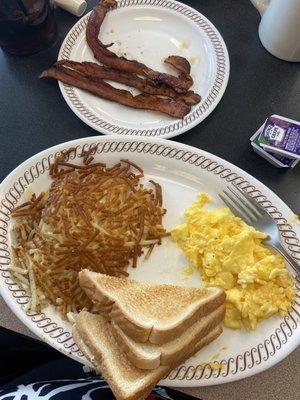 Scrambled eggs with cheese, toast, hash browns & toast with bacon