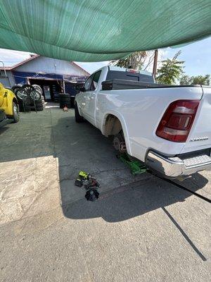 Them taking off the tire and repairing